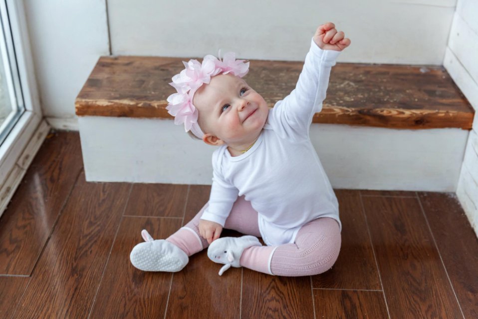 Fall baby clothing essentials including layered outfits, light sweaters, and warm accessories