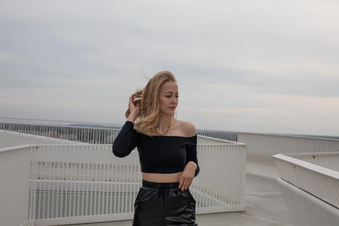 Collection of high-quality tops from various premium brands showing different price points and styles