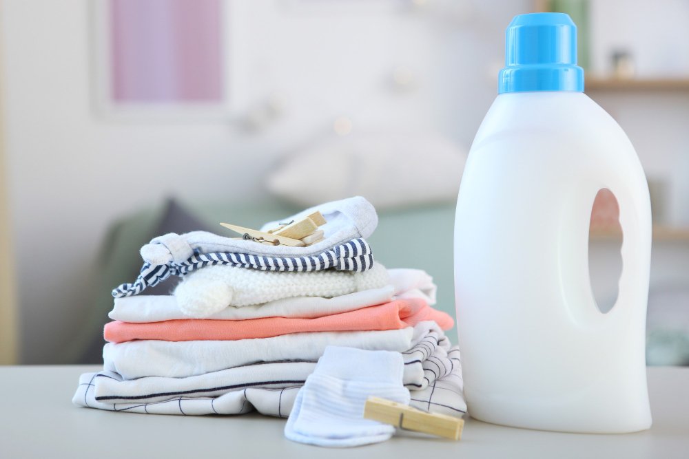 Proper baby clothes washing and care setup with gentle detergents and organized storage