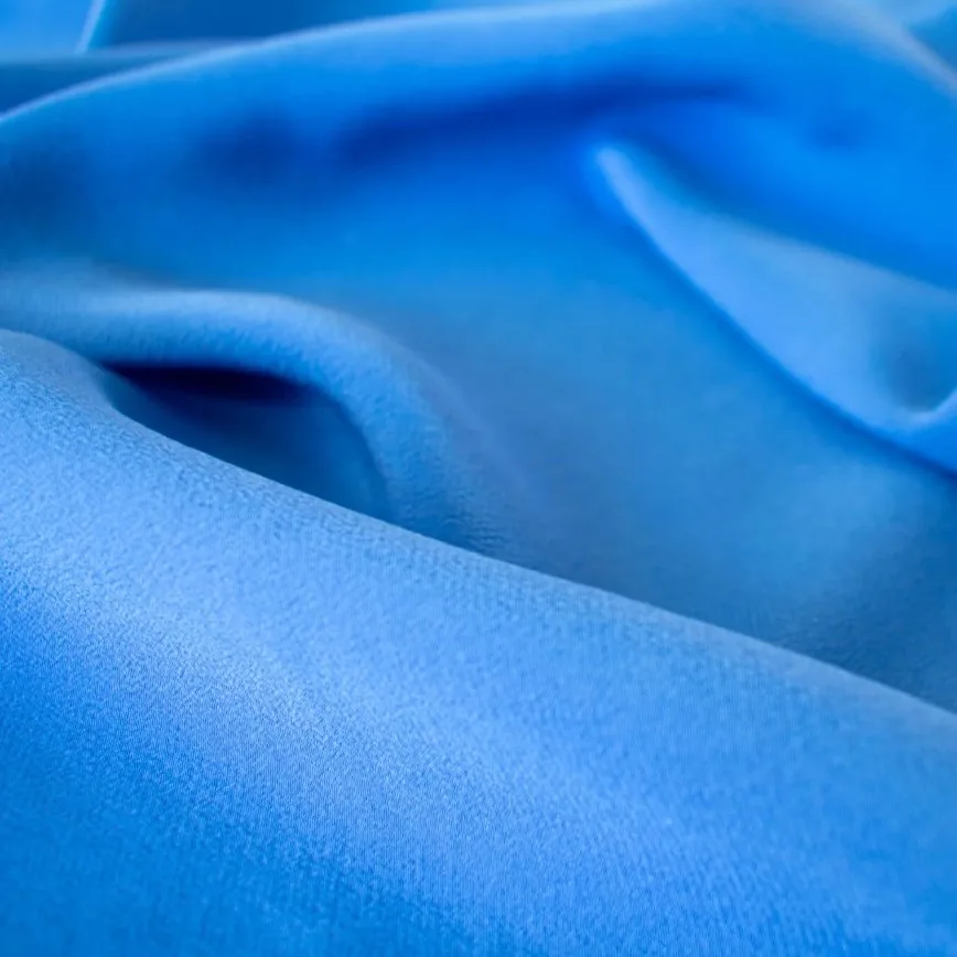smooth blue French silk fabric with luxurious sheen and elegant drape