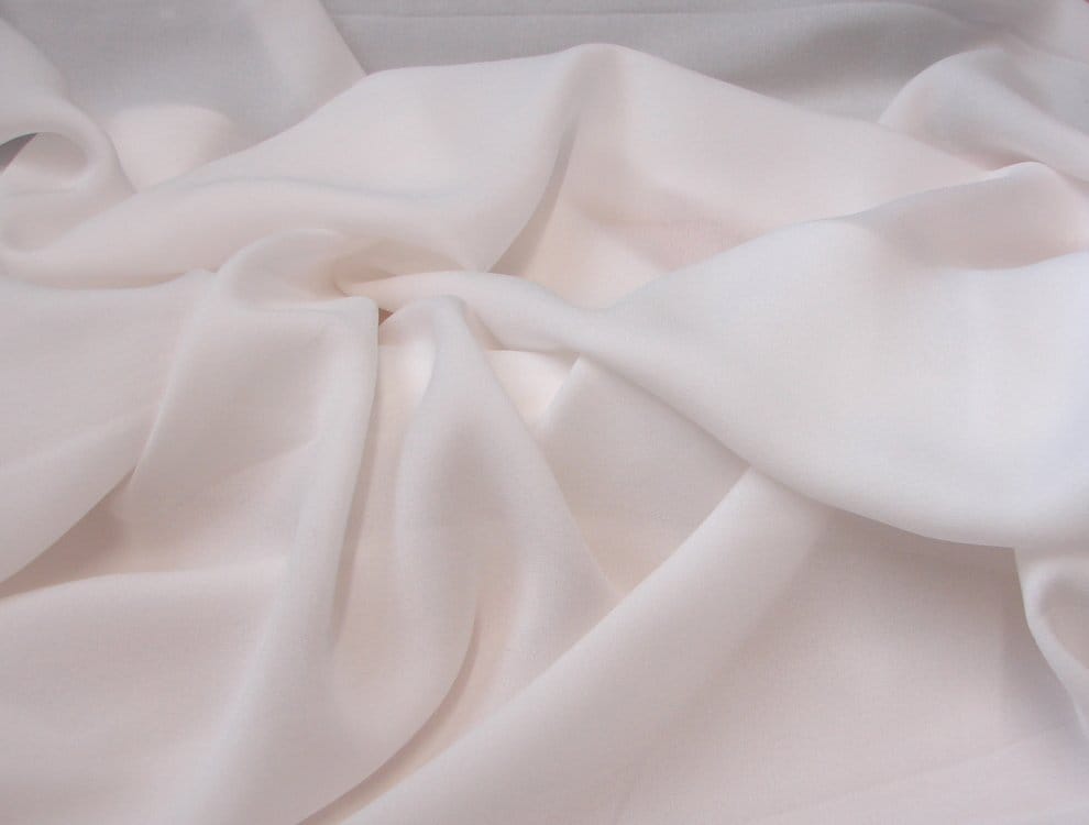 Soft white georgette fabric with lightweight semi sheer texture and fluid drape