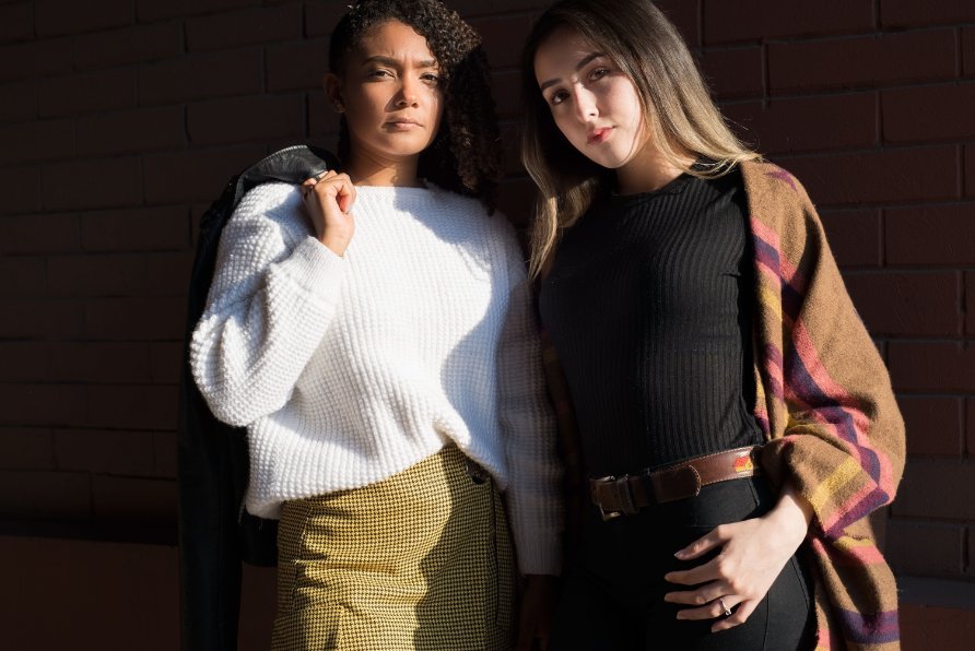 Examples of layered outfits showing different styling techniques with various tops, cardigans, and blazers