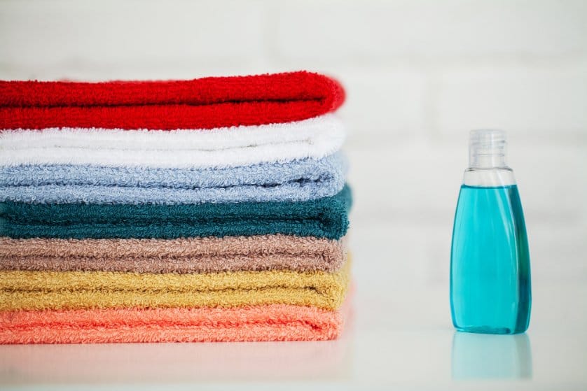 soft colourful clothes on the table with fabric softner