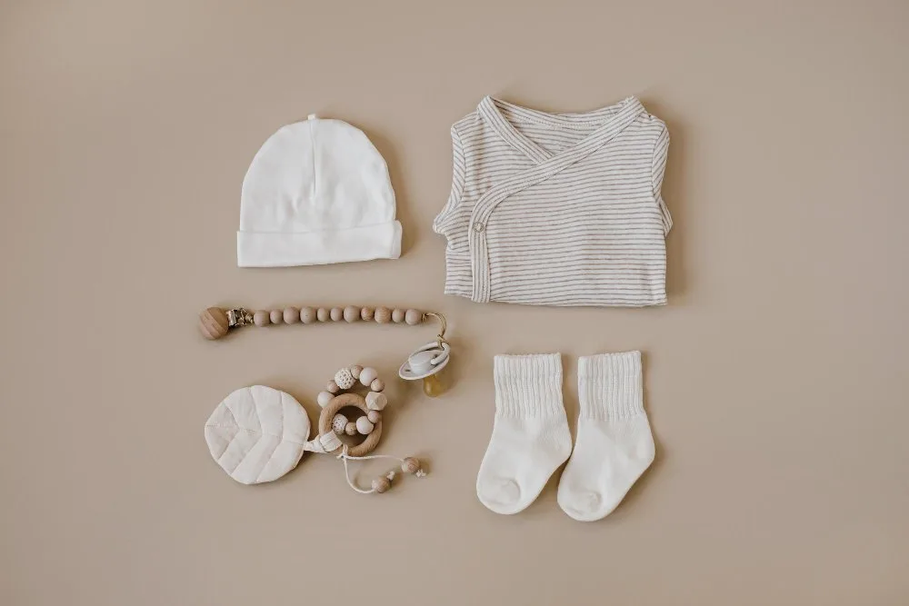 Organic baby clothing options showing natural cotton and sustainable materials