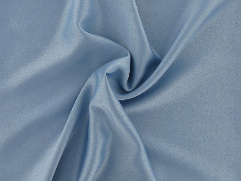Soft satin crepe fabric with smooth sheen on one side and textured drape