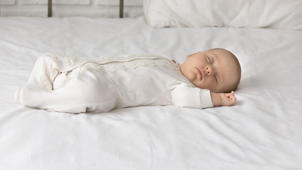 Safe sleep clothing options for babies including sleep sacks, pajamas, and appropriate layering