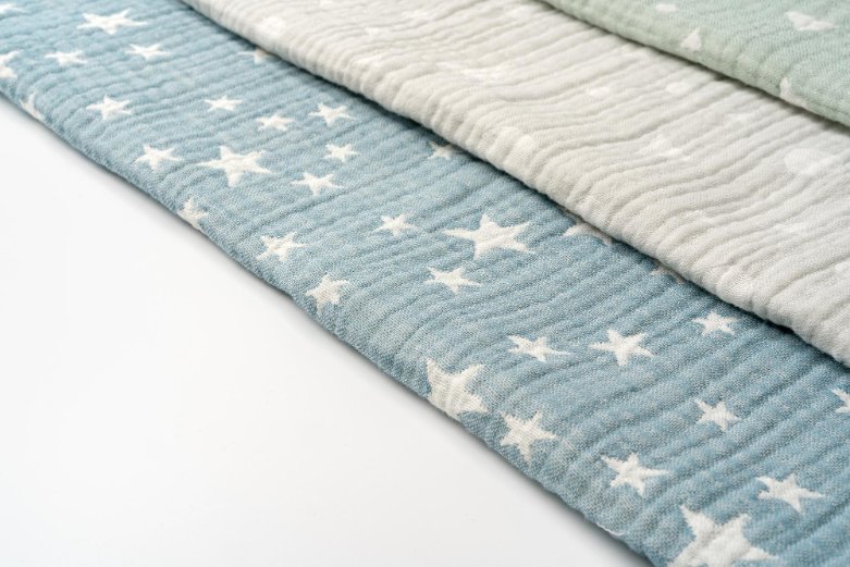 Safe fabric choices for newborns showing soft, breathable materials and proper clothing fits