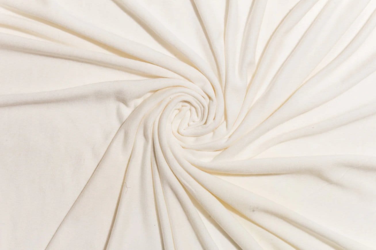 Smooth bamboo fabric in light cream color with soft drape