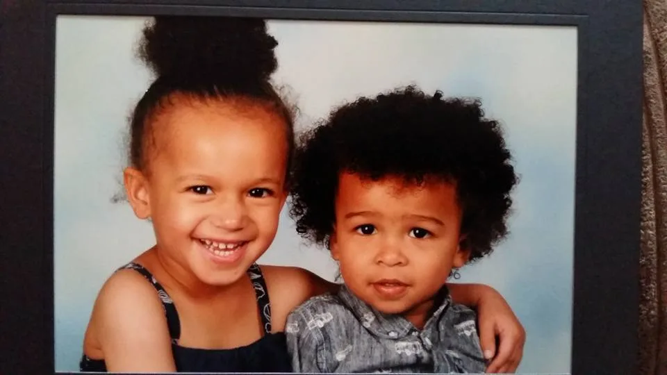 happy siblings clothing digest a boy and girl smiling while taking a picture