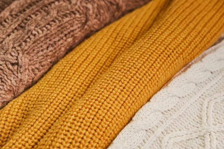 close-up of knitted fabric showing interlocked yarn loops that create stretch and comfort
