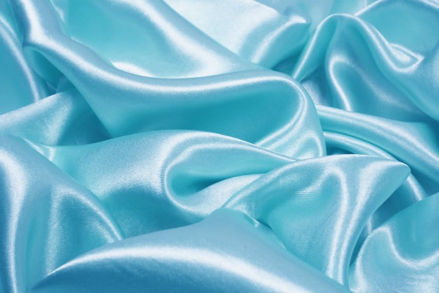 Light blue satin fabric with glossy finish and smooth reflective surface