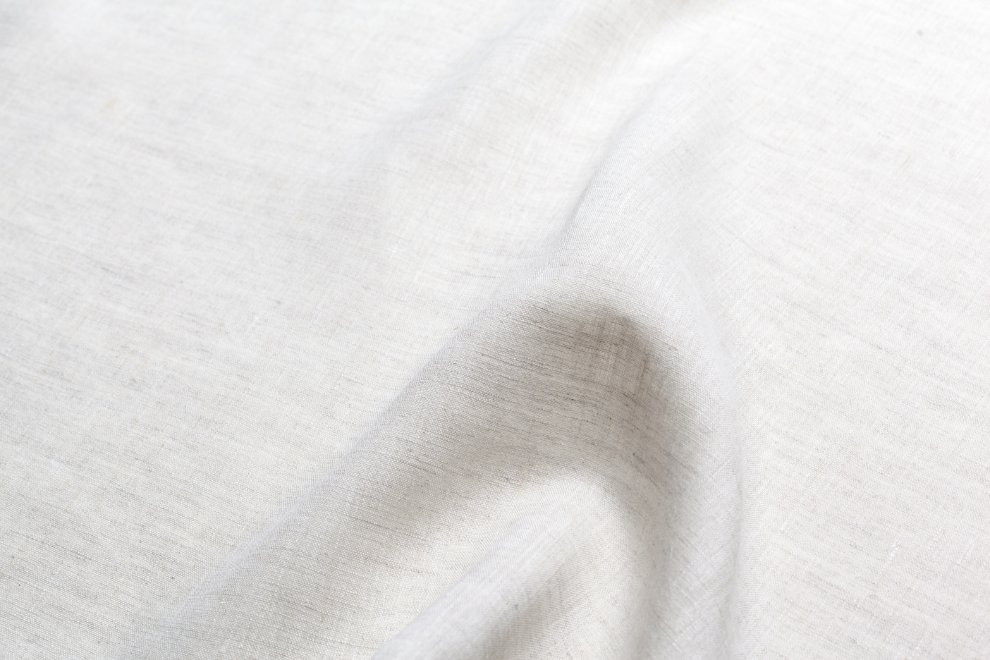 Collection of sustainable baby clothing materials including bamboo, hemp, and organic cotton fabrics