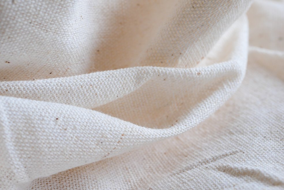 Organic and sustainable fabrics in newborn fashion including organic cotton, bamboo, and eco-friendly materials