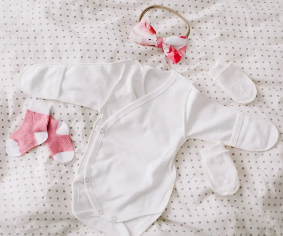 NICU-friendly preemie clothing features showing snap closures, side openings, and medical equipment access points