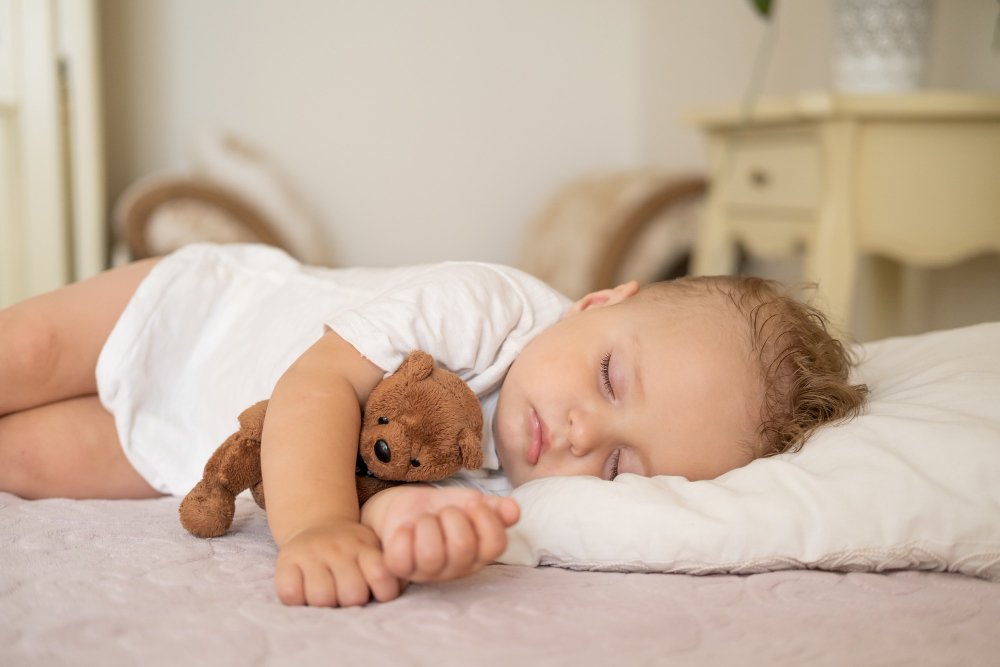 Baby sleep clothing options arranged by season showing summer and winter appropriate sleepwear