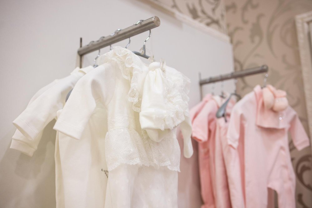 Smart shopping strategies for sustainable baby fashion showing budget-friendly eco-conscious baby clothing shopping tips