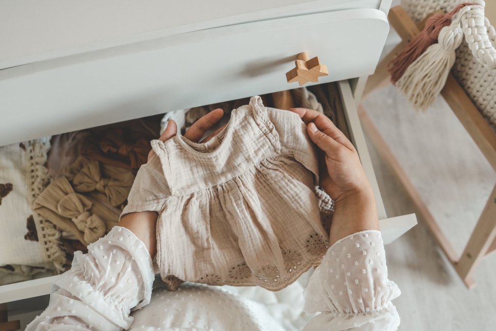 Comparison of organic and conventional baby clothing materials showing natural fibers versus chemically treated fabrics
