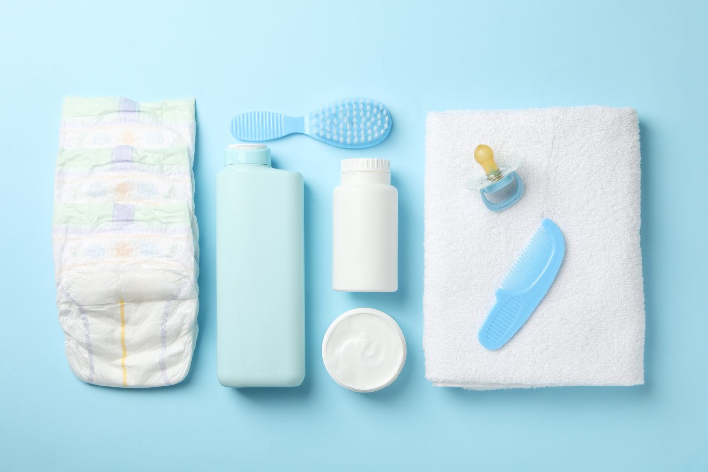 Baby bathing and grooming essentials including infant bathtub, towels, gentle shampoo, and grooming tools