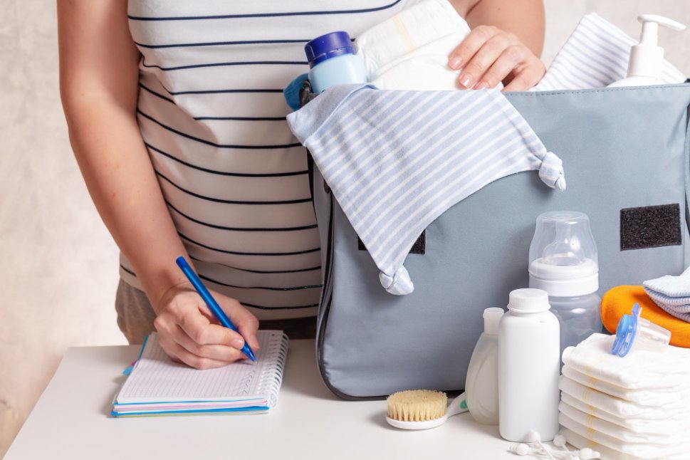Baby feeding and nursing essentials including bottles, breast pump, nursing pillow, and feeding accessories