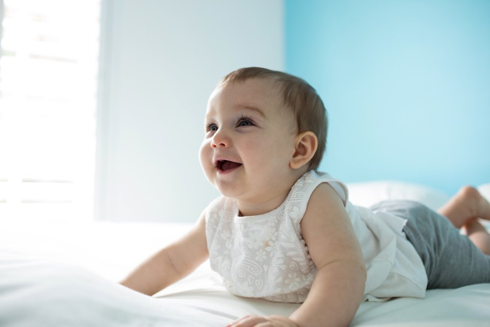 Baby clothing in different sizes showing proper fit for growing babies with sensitive skin