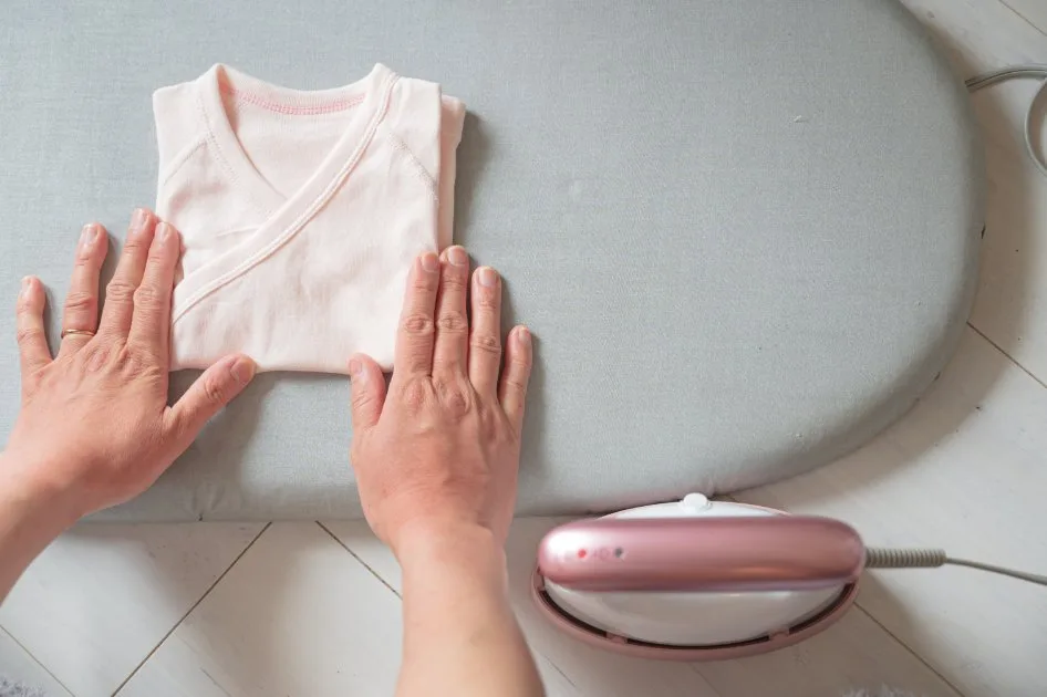 Gentle washing and care routine for preemie clothes showing proper detergents, washing techniques, and storage methods