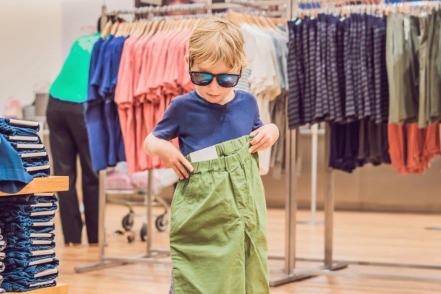 A little boy checking out a massive pant