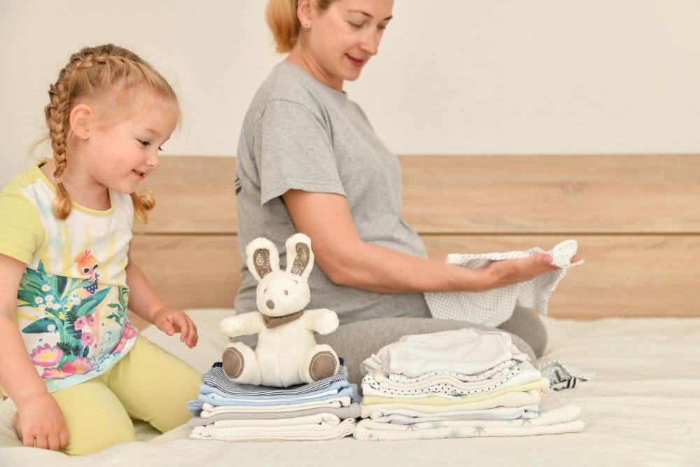 Mother and daughter sorting clothes