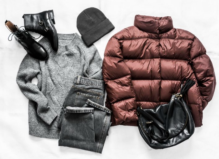 Essential outerwear pieces including blazers, coats, and jackets displayed on hangers