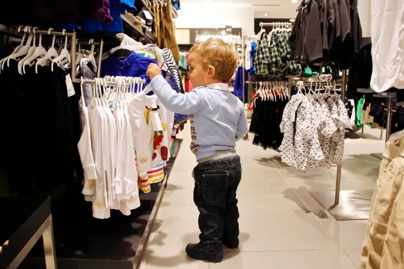 Smart shopping strategies for toddler clothing including seasonal sales and budget-friendly tips