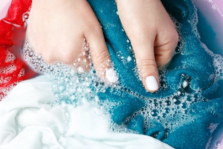 Female hands hand washing clothes