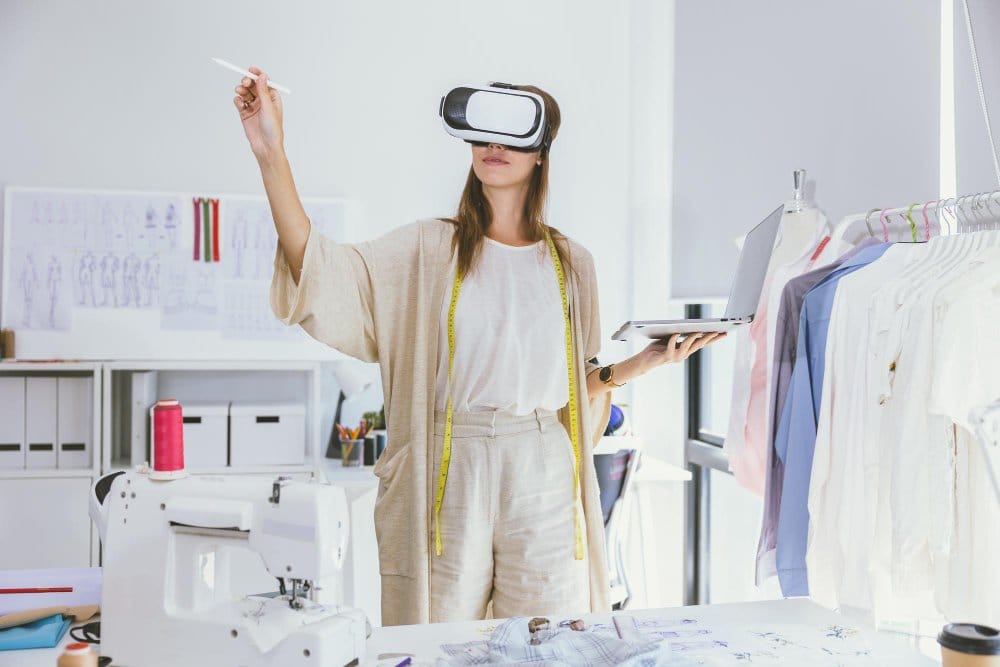 Fashion designer using virtual reality technology in studio