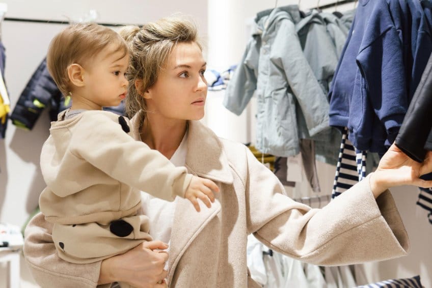 Mother and son shopping for clothes
