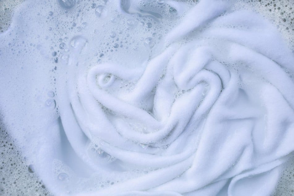 cashmere dipped into soapy water for washing