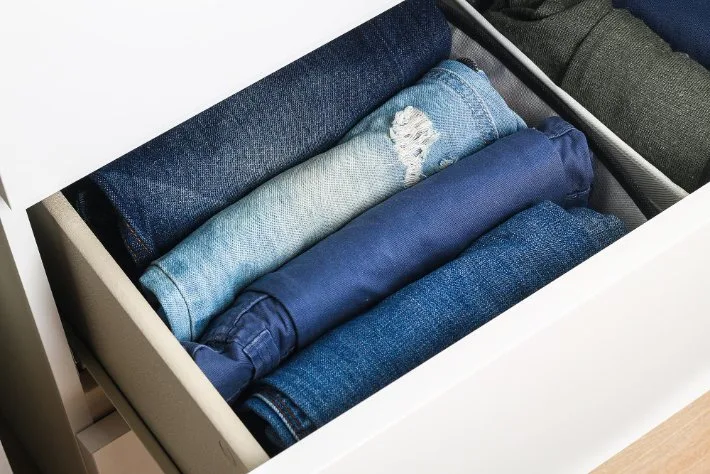 Care and maintenance guide showing washing symbols, fabric care instructions, and storage tips for pants and trousers