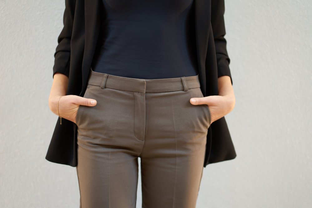 Collection of different types of pants and trousers including jeans, chinos, dress pants, and casual styles