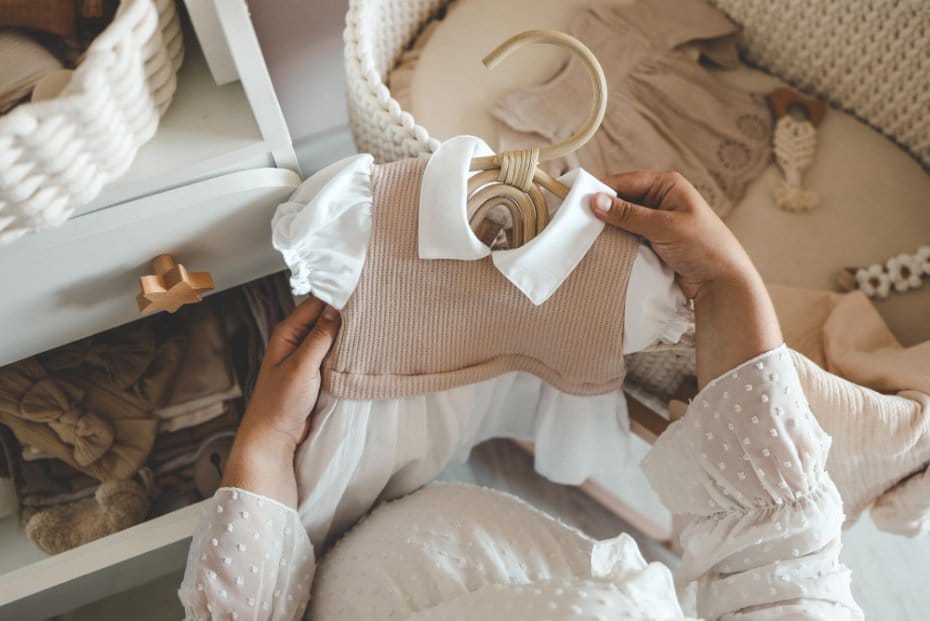 A woman checking out a toddler outfit
