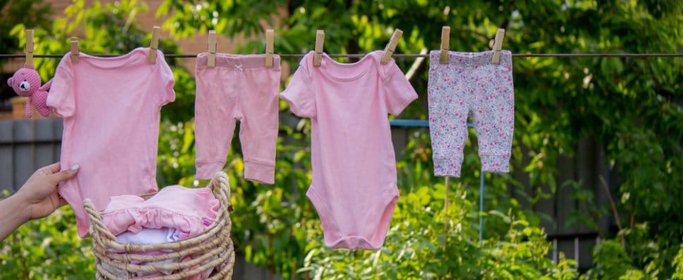baby clothing hung on a line dryer