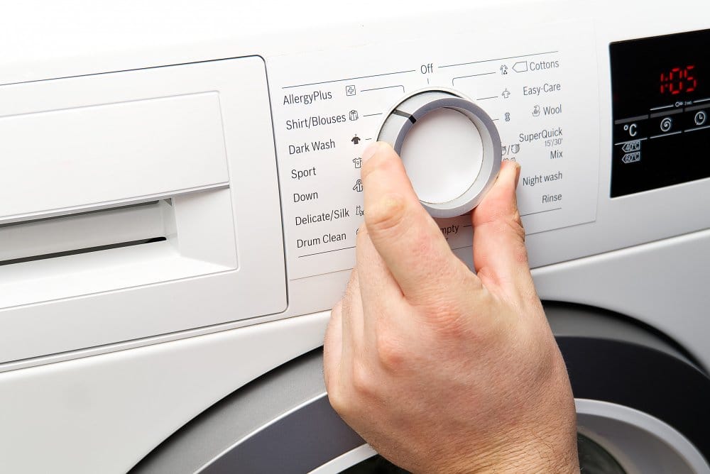 A man setting a washing machine