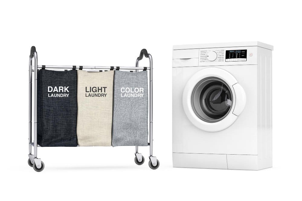 A trolley with three empty clothing colour separation compartments and a washing machine