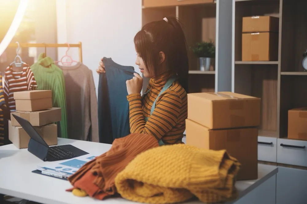 Boxes packed full of sold kids clothes