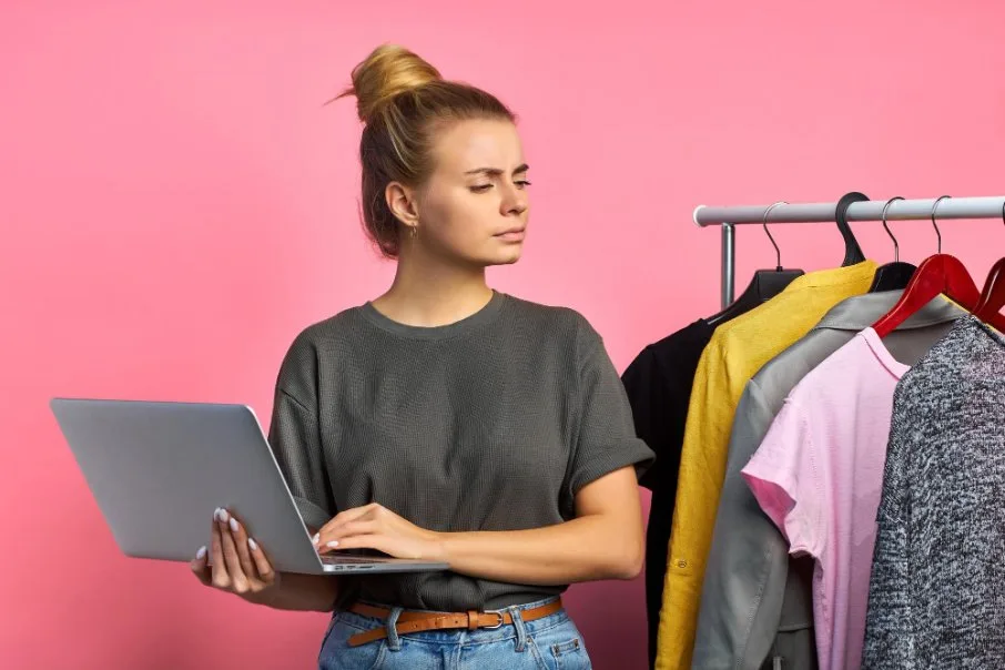 Woman wondering how much price to set for items being sold on poshmark