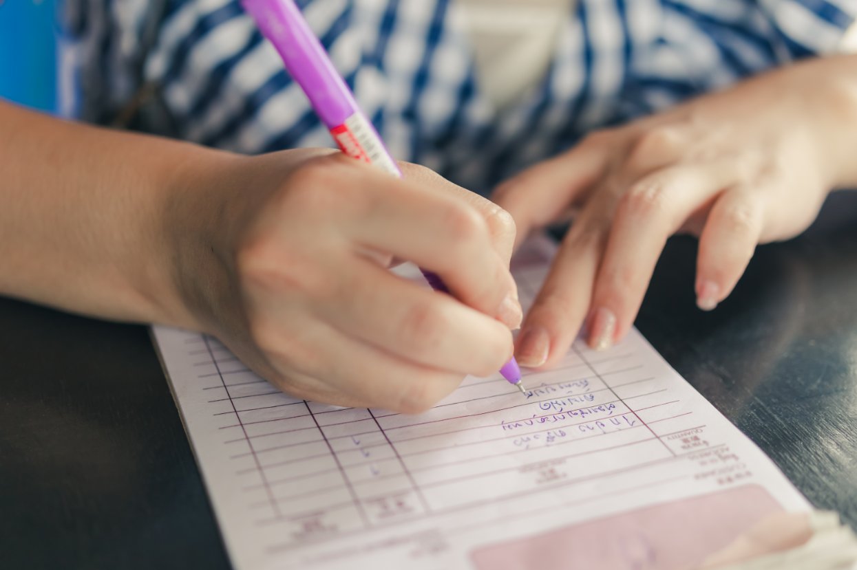 Comprehensive checklist of daycare items to label including clothes, bottles, bags, and supplies laid out with labels
