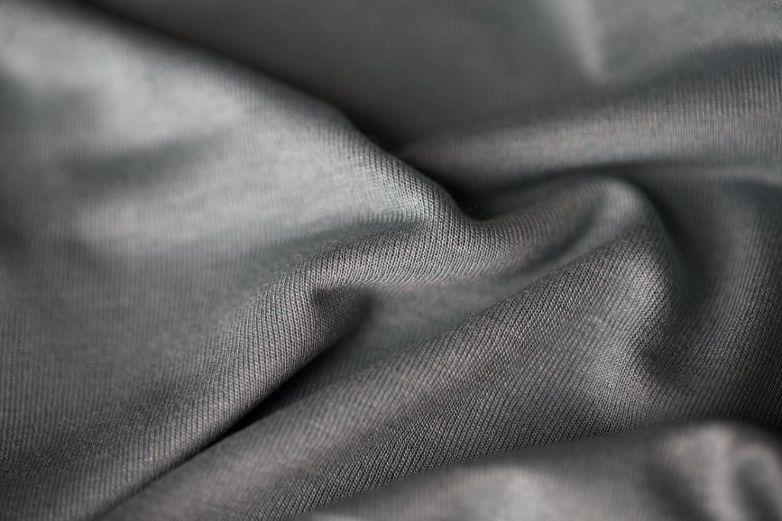 Different fabric types used in children's sleepwear including cotton, polyester, and organic materials