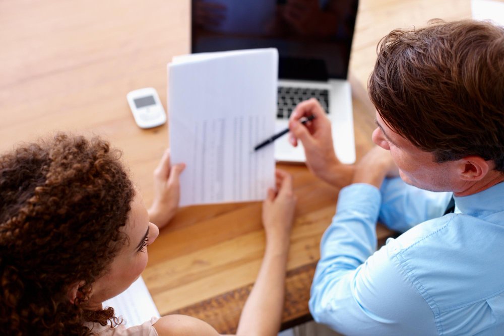 Parent following safety checklist while examining children's pajamas and sleepwear labels