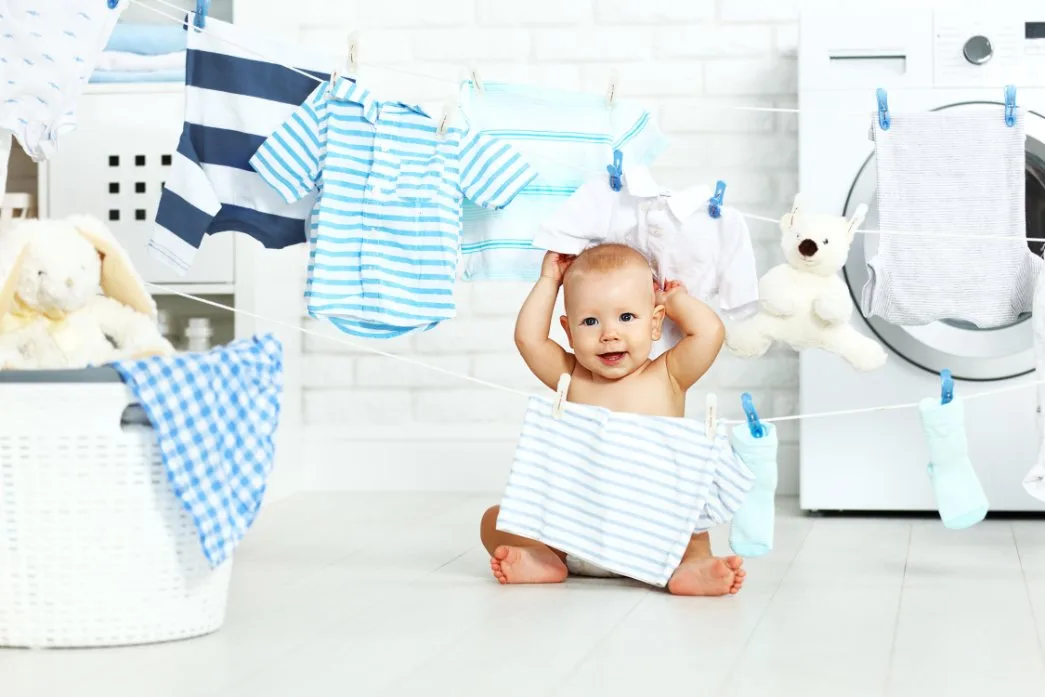 Step-by-step guide to proper baby clothes washing techniques showing safe detergents and washing methods