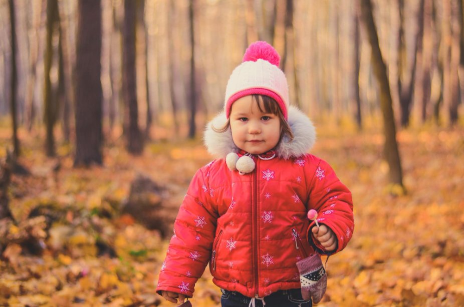 Seasonal toddler clothing laid out showing summer and winter essentials