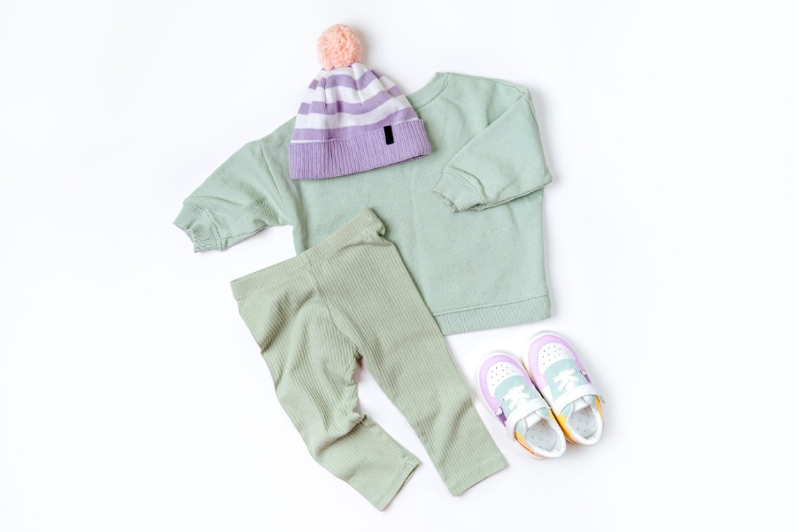Specialty toddler clothing including swimwear, rain gear, and outdoor play clothes for various activities