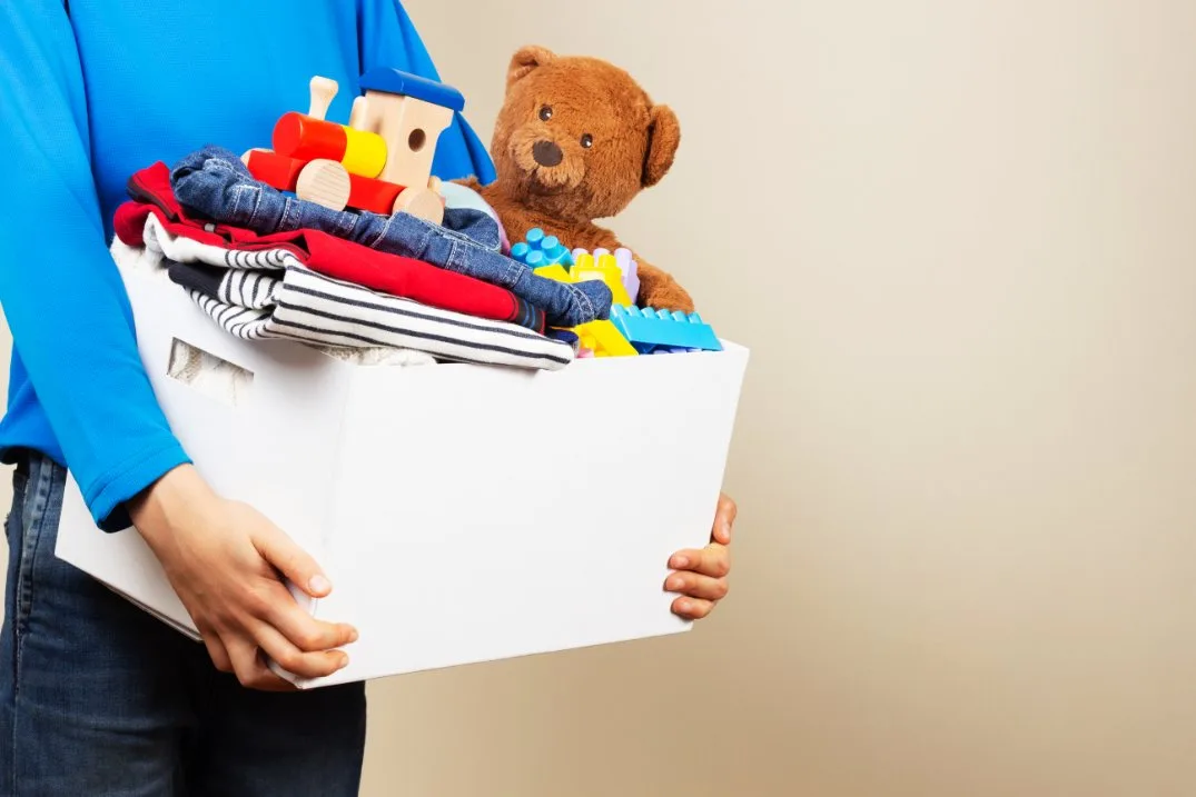 Collection of items beyond clothes including toys, shoes, and accessories suitable for donation