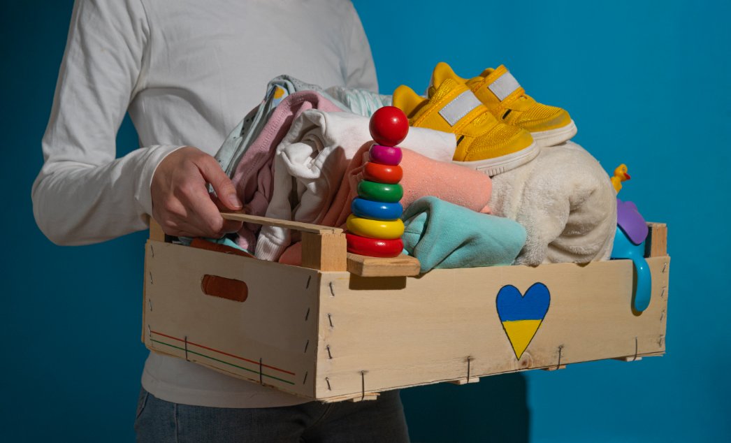 Children and families benefiting from clothing donations in a community setting