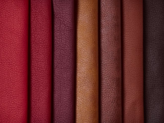 Close up of textured leather material in rich brown and red tones